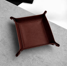 Load image into Gallery viewer, A Handmade Brown Leather Desk Tidy Valet Tray, with raised corners and stitched edges, photographed from above on a light grey textured surface.