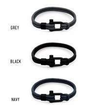 Load image into Gallery viewer, Three braided bracelets in grey, black, and navy with black clasp on a white background.