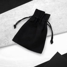 Load image into Gallery viewer, Black luxury Parker &amp; Co. large cotton gift bag, styled on a modern monochrome background.